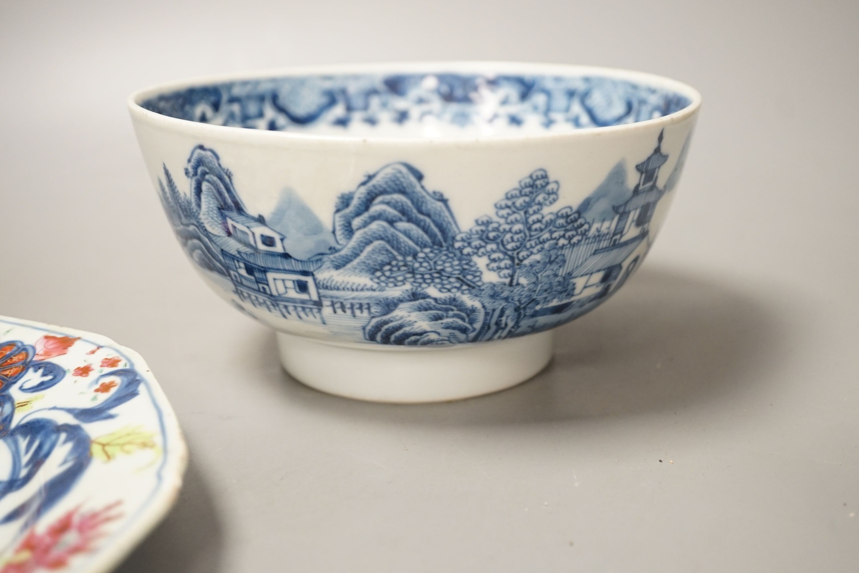 An 18th century Chinese famille rose ‘birds and lotus’ plate, and a Chinese blue and white ‘landscape’ bowl, 17.6cm